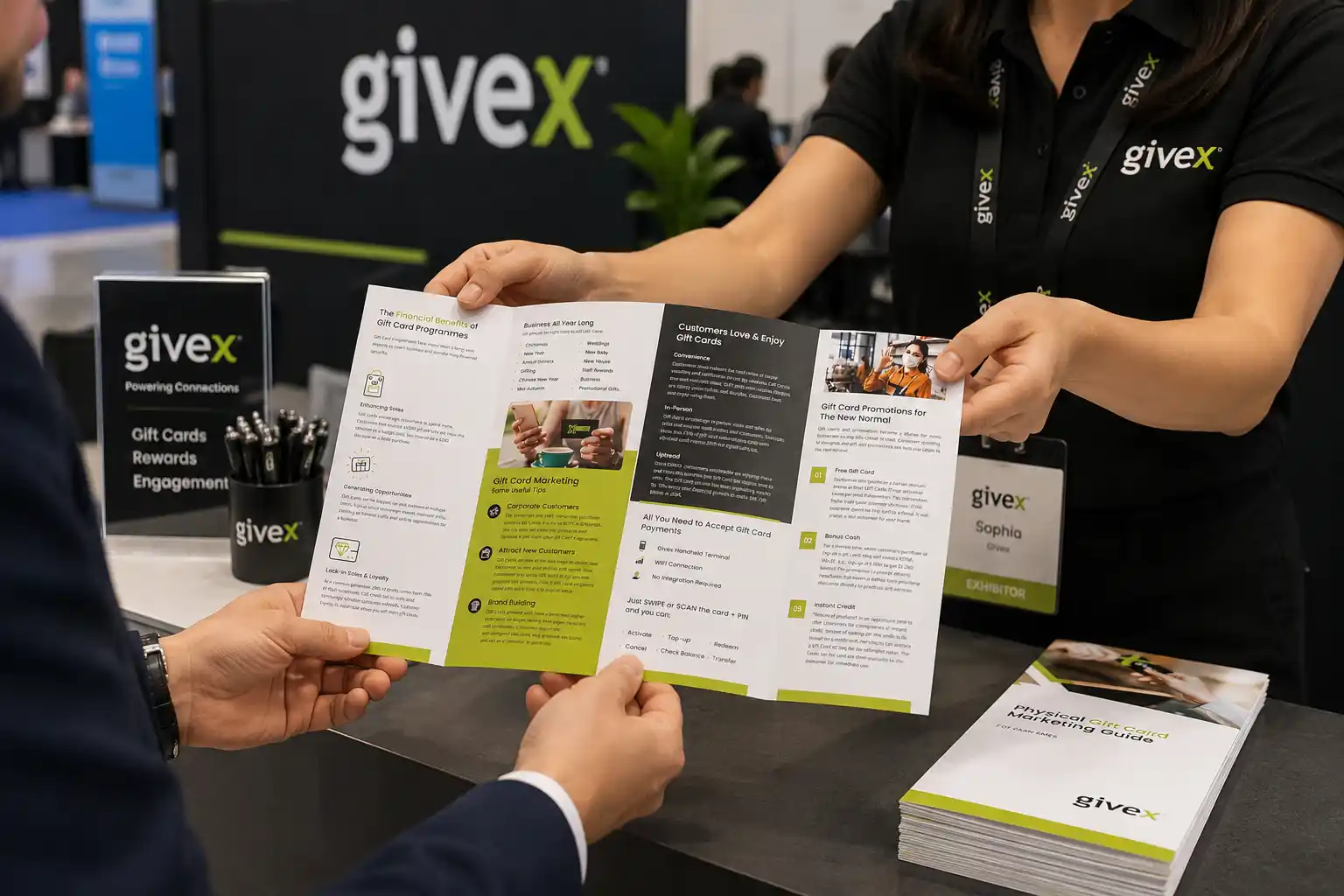 Givex gift card brochure being presented in a trade-show setting